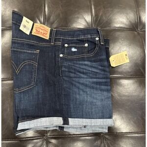 Levi's Women Size 33 Mid Length Blue Denim Shorts Cuffed Dark Distressed Stretch